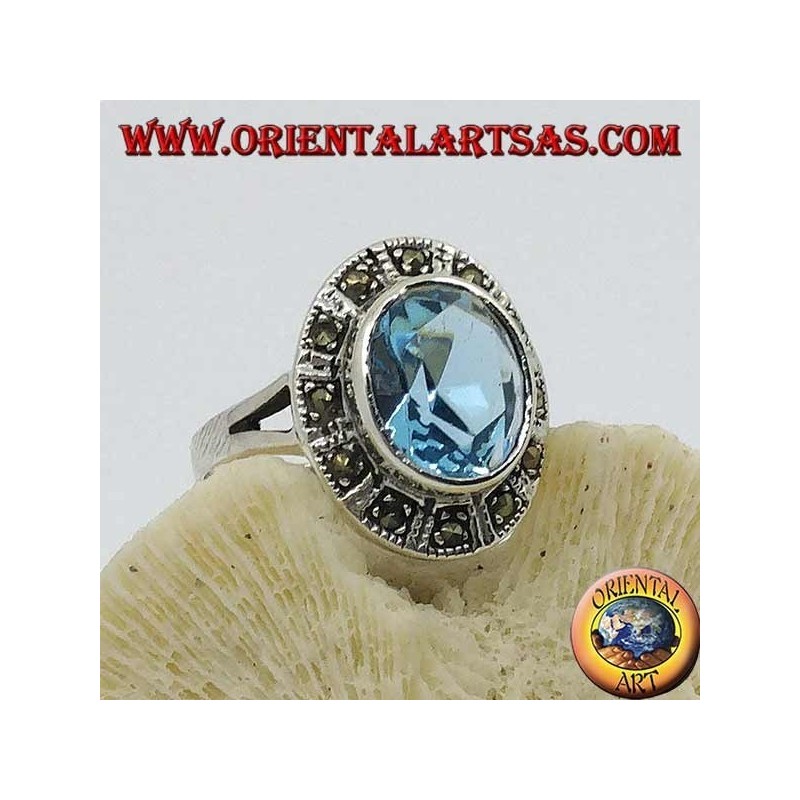 Large oval silver ring with blue topaz surrounded by marcasite