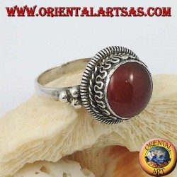 Silver ring with raised round carnelian and stripes and continuous serpentine on the sides