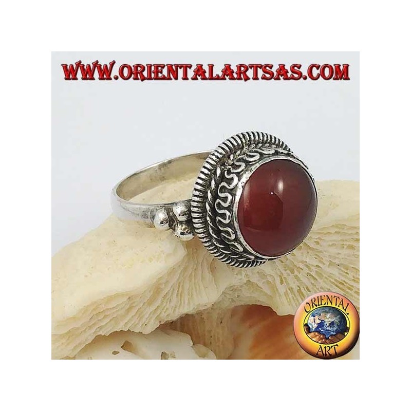 Silver ring with raised round carnelian and stripes and continuous serpentine on the sides