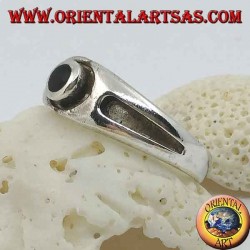 Silver ring with round onyx and thick bas-relief line on the sides