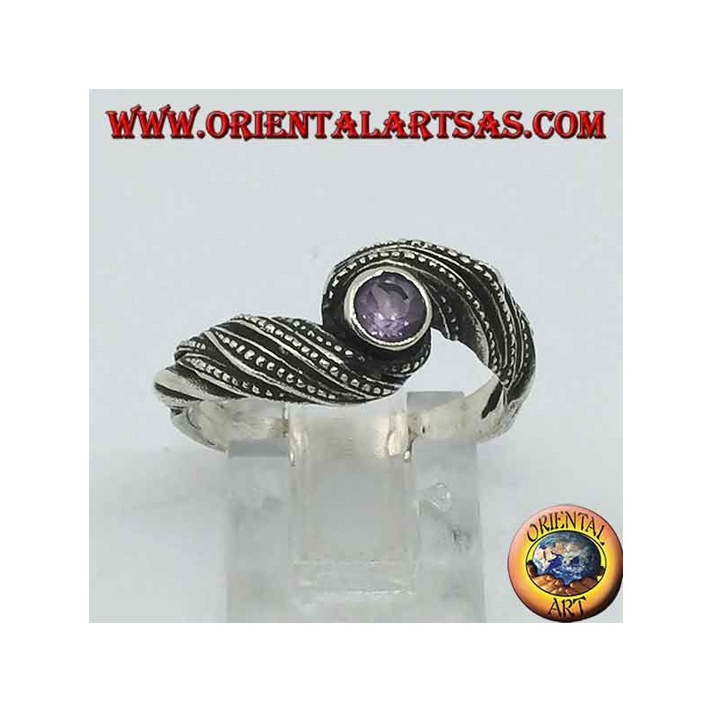 Silver ring with natural round amethyst in an interweaving of threads