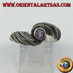 Silver ring with natural round amethyst in an interweaving of threads