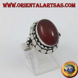 Silver ring with high edge with oval cabochon carnelian