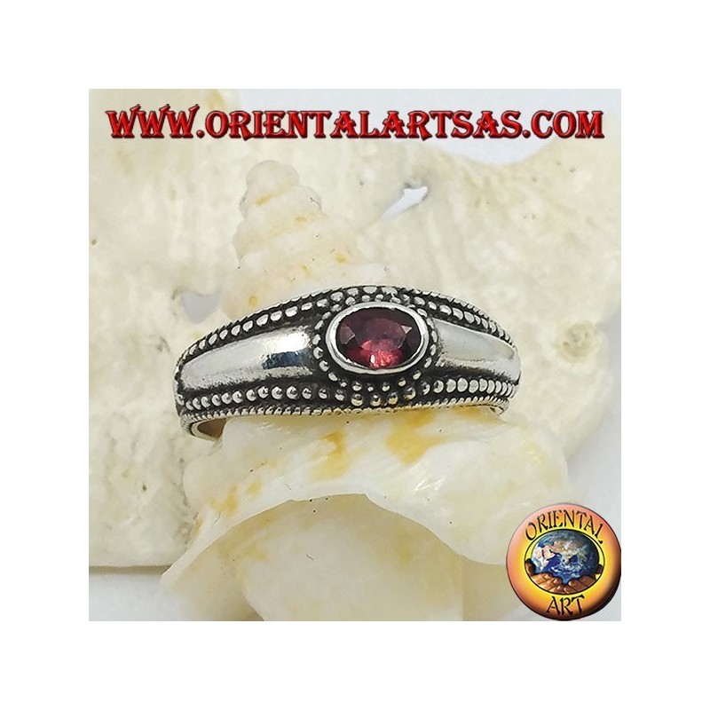 Silver ring with horizontal oval garnet and balls decoration