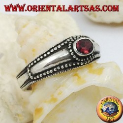 Silver ring with horizontal oval garnet and balls decoration