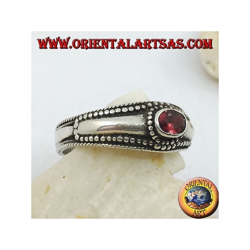 Silver ring with horizontal oval garnet and balls decoration