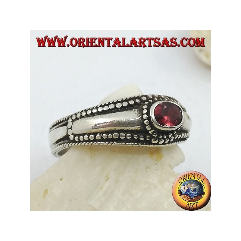 Silver ring with horizontal oval garnet and balls decoration
