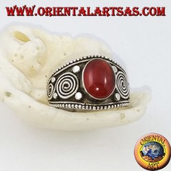 Silver ring with oval carnelian and spirals on the sides