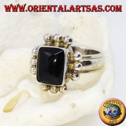 Silver ring with rectangular onyx and row of three balls on each side
