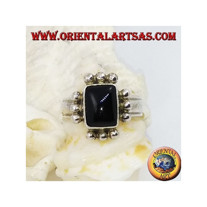 Silver ring with rectangular onyx and row of three balls on each side