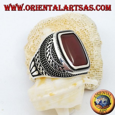 Silver ring with rounded rectangular carnelian in an engraved rose window
