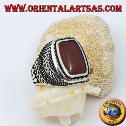 Silver ring with rounded rectangular carnelian in an engraved rose window