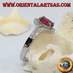 Silver ring with synthetic oval ruby set surrounded by a row of double cubic zirconia