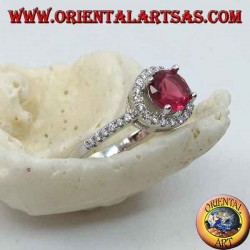Silver ring with synthetic round ruby set surrounded by a row of zircons