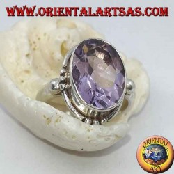 Silver ring with natural faceted oval amethyst and triple dots on the cardinal points