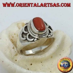 Silver ring with oval natural coral of ancient Tibetan origin with semicircles on the sides