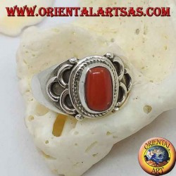 Silver ring with oval natural coral of ancient Tibetan origin with semicircles on the sides