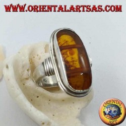 Silver ring with oval natural amber of ancient Tibetan origin and striped frame