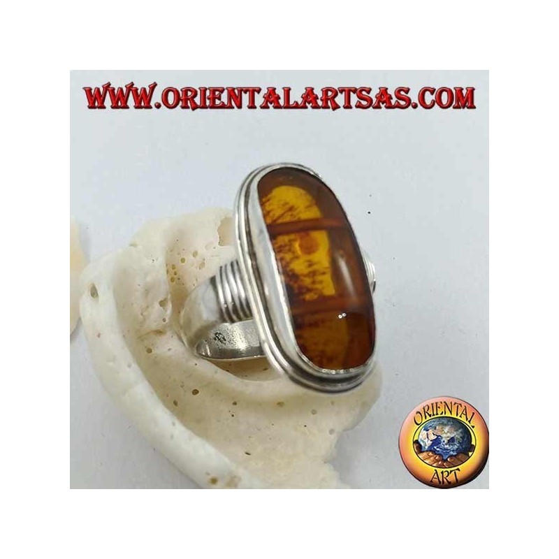 Silver ring with oval natural amber of ancient Tibetan origin and striped frame