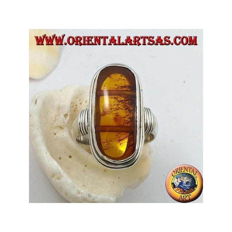 Silver ring with oval natural amber of ancient Tibetan origin and striped frame