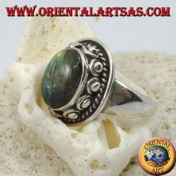 Silver ring with oval labradorite surrounded by studs and braid