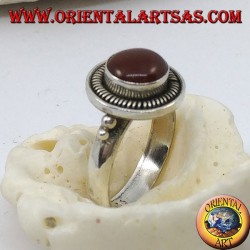 Silver ring with round carnelian raised in the circle and stripes