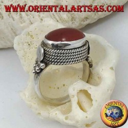 Silver ring with natural oval carnelian sideways surrounded by four rows of dots