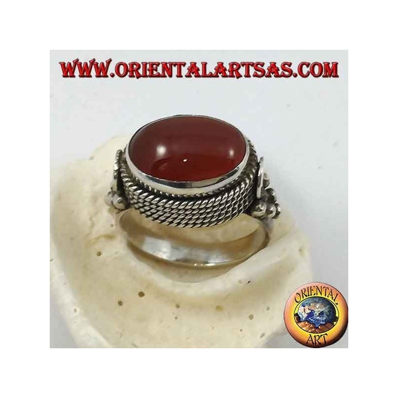 Silver ring with natural oval carnelian sideways surrounded by four rows of dots
