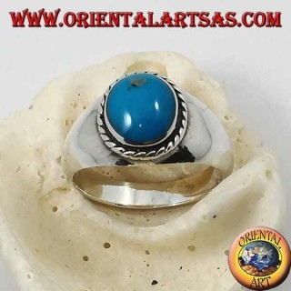 Silver ring with oval cabochon turquoise surrounded by a braid