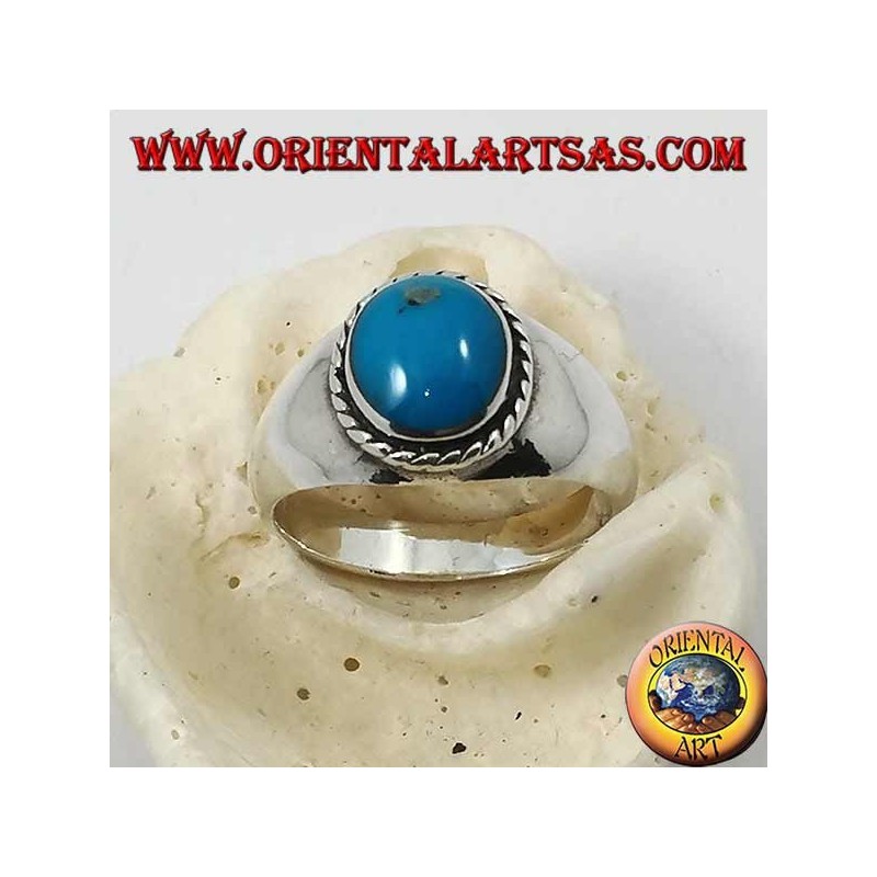 Silver ring with oval cabochon turquoise surrounded by a braid