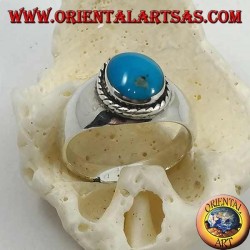 Silver ring with oval cabochon turquoise surrounded by a braid