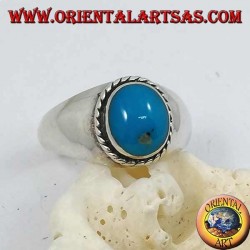 Silver ring with oval cabochon turquoise surrounded by a braid