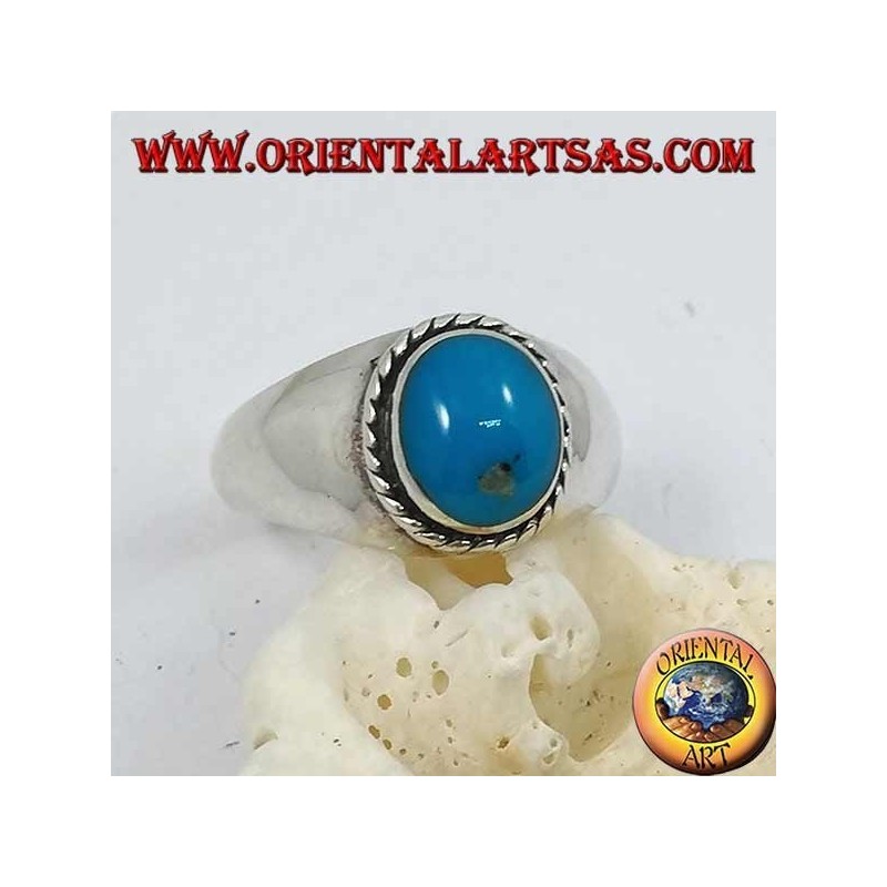 Anillo de plata con un cabujón oval turquesa rodeado de una trenza