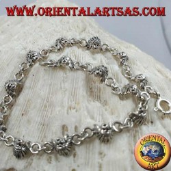 Soft silver bracelet with faces of a native American Indian
