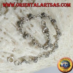 Soft silver bracelet with faces of a native American Indian