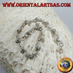 Soft silver bracelet with faces of a native American Indian