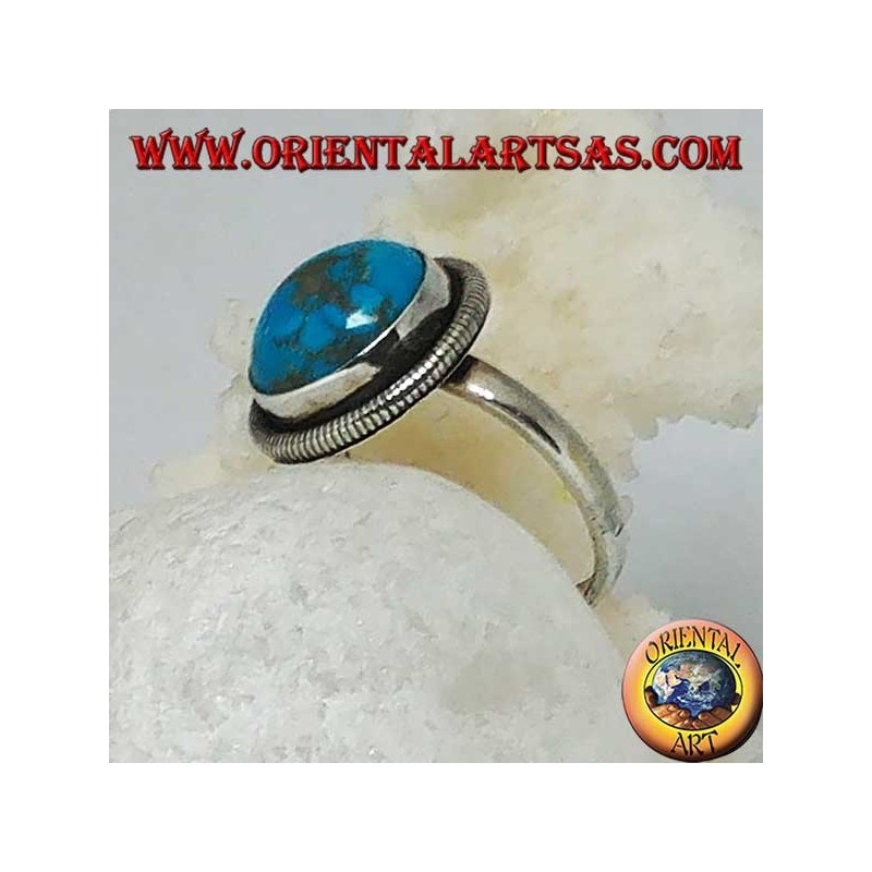 Silver ring with a round cabochon turquoise surrounded by a row of disks (16)
