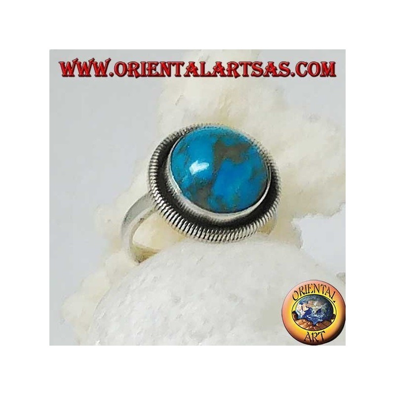 Silver ring with a round cabochon turquoise surrounded by a row of disks (16)