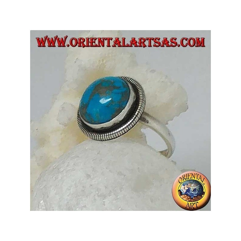 Silver ring with a round cabochon turquoise surrounded by a row of disks (16)