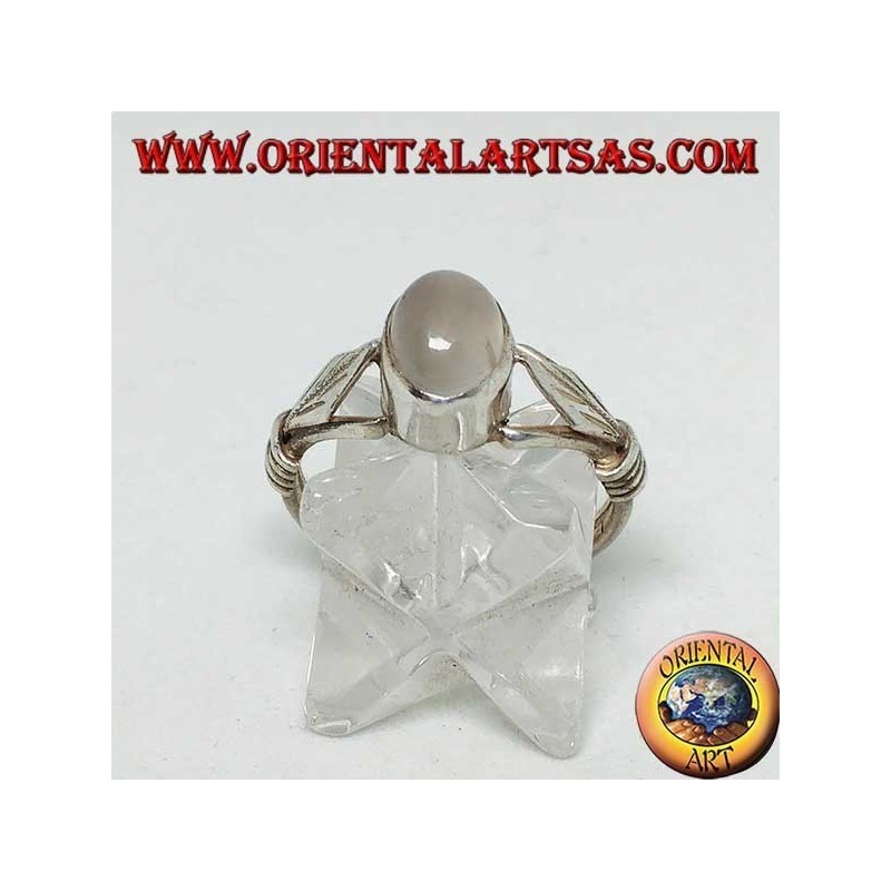 Silver ring with oval moonstone and rhomboid leaf with discs on the sides