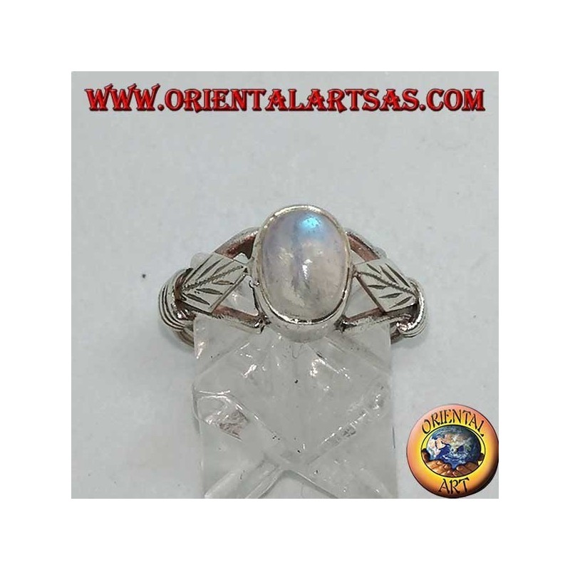 Silver ring with oval rainbow moonstone and rhomboid leaf with discs on the sides