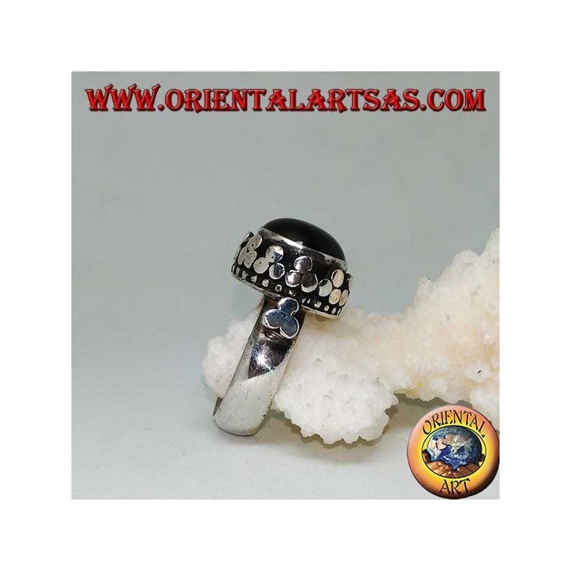 Silver ring with raised Black Star surrounded by disc clovers
