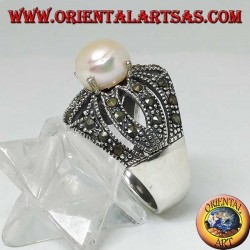 Silver ring with natural pearl set on an openwork cross frame studded with marcasite