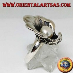 Silver ring with natural pearl in the oyster coat