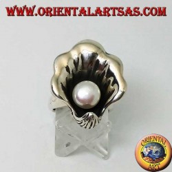 Silver ring with natural pearl in the oyster coat