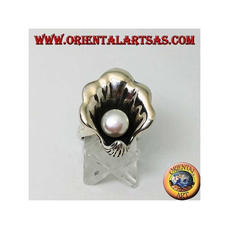 Silver ring with natural pearl in the oyster coat