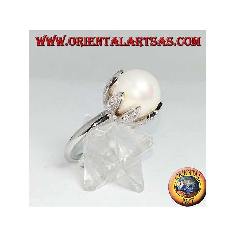 Silver ring with giant natural pearl set in the petals of a flower
