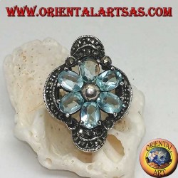 Silver Bethlehem flower ring with blue topaz petals set crowned with silver and marcasite