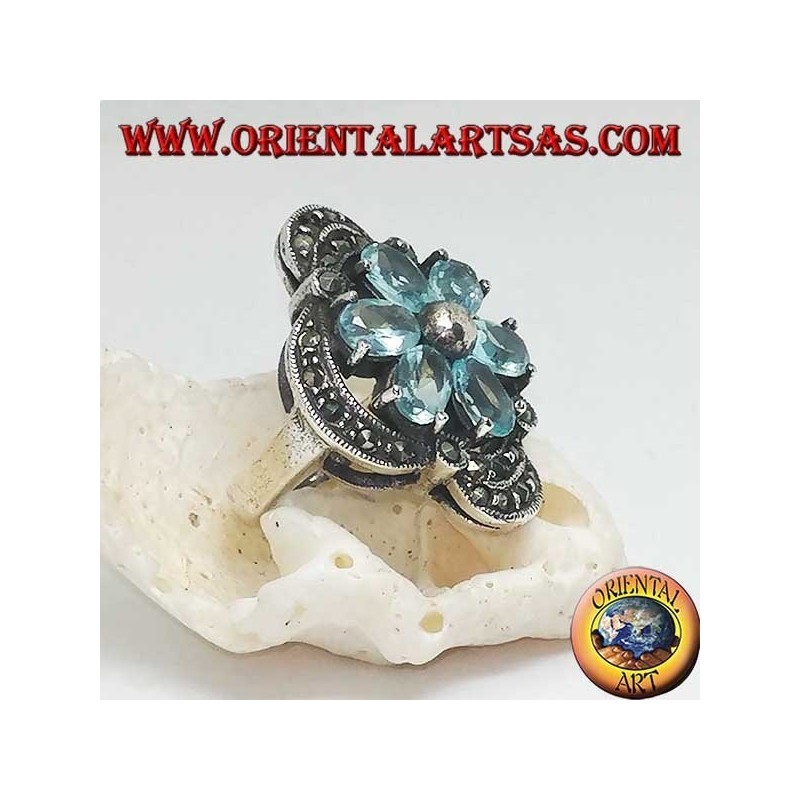 Silver Bethlehem flower ring with blue topaz petals set crowned with silver and marcasite