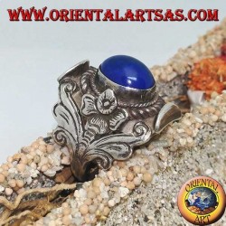 Silver ring with oval cabochon lapis lazuli and Nepalese setting with flower on the sides
